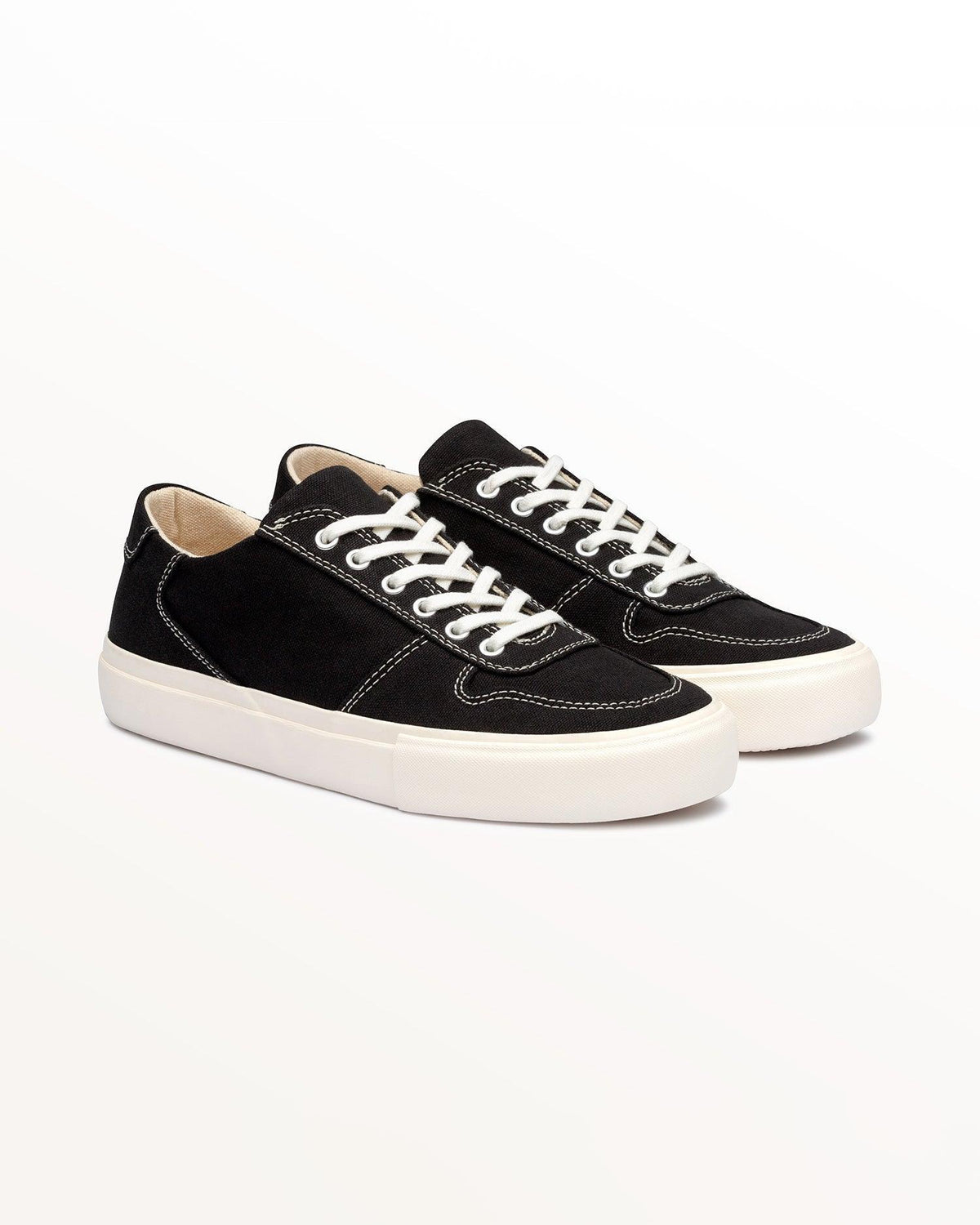 Pair of Bal Black/White trainers, three-quarter front view