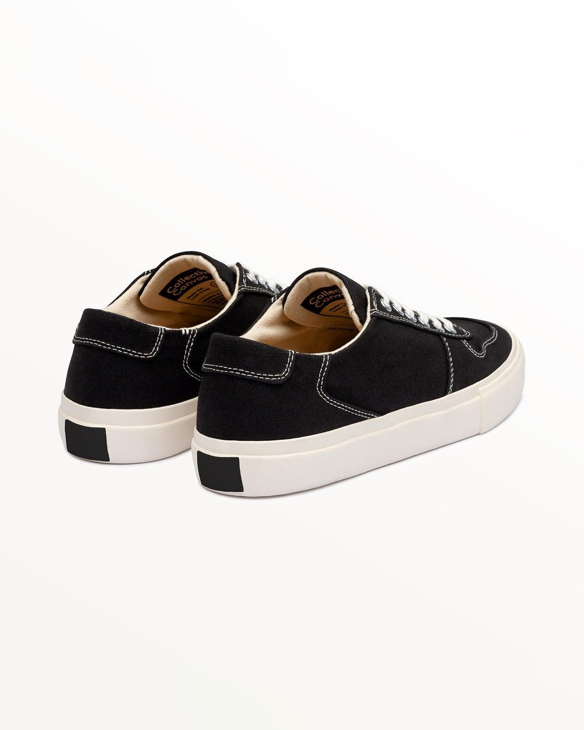 Bal Black/White trainers, three-quarter rear view showing black heel patch on the off-white sole