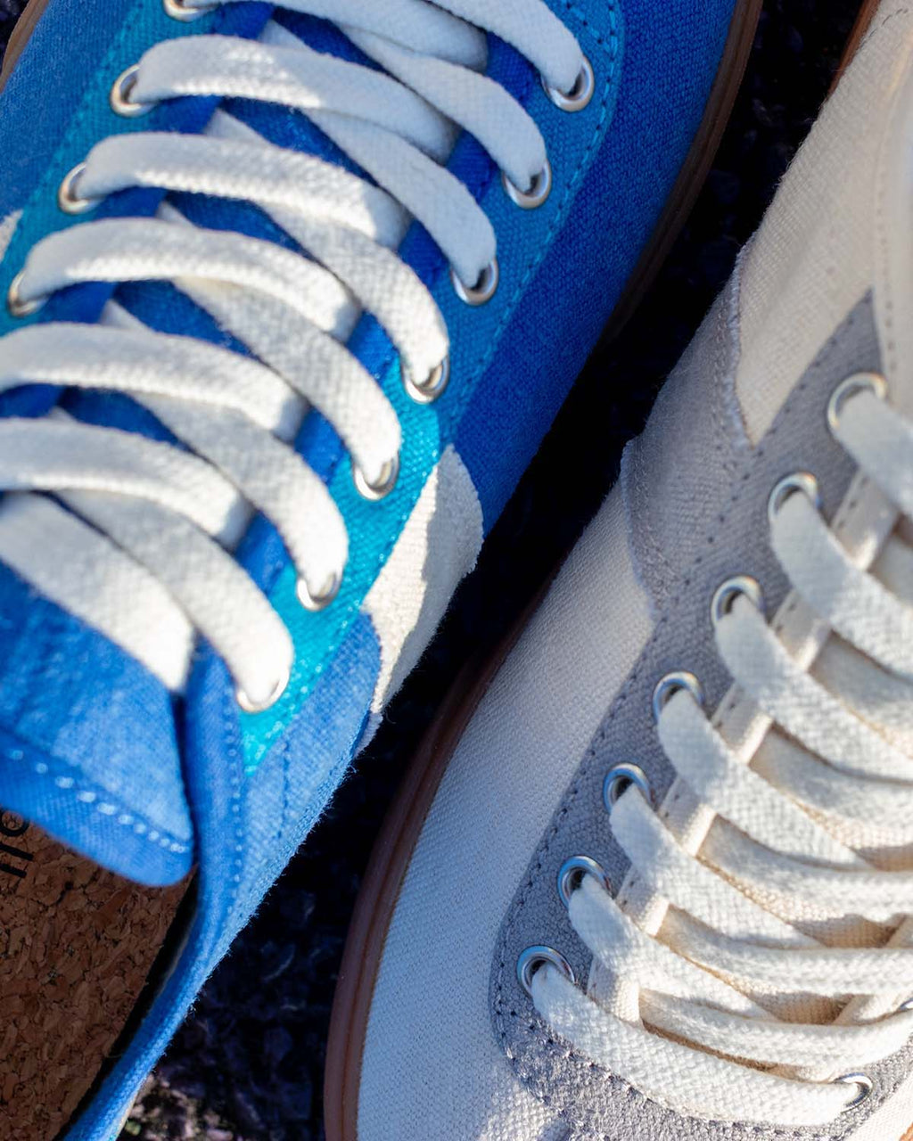 Looper Hemp Blue trainer beside a Looper Ecru/Grey, close-up of laces and hemp canvas uppers