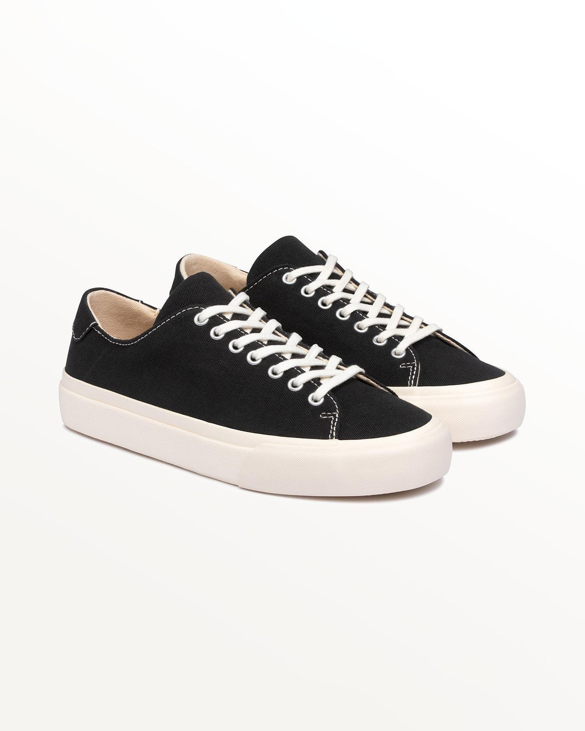 Pair of Baan Black/White trainers, three-quarter front view