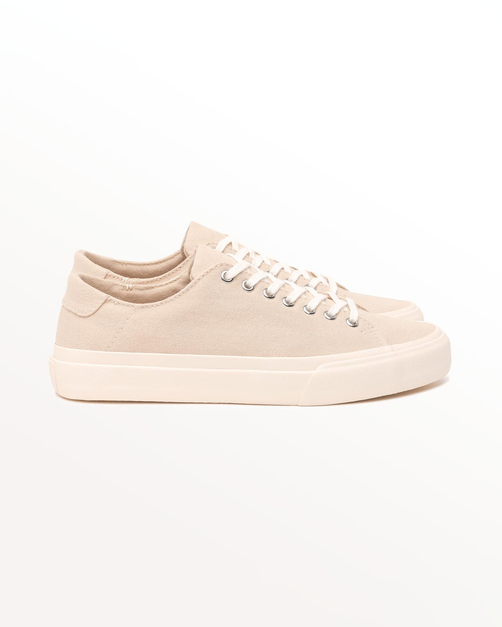Baan Natural trainer, side view of organic cotton canvas upper on an off-white rubber sole