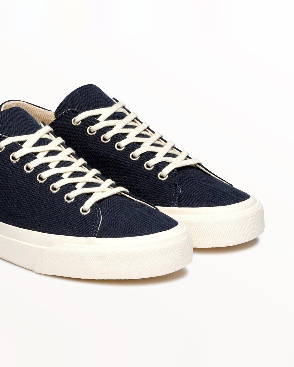 Close-up of navy organic cotton canvas upper and cream laces on Baan Navy