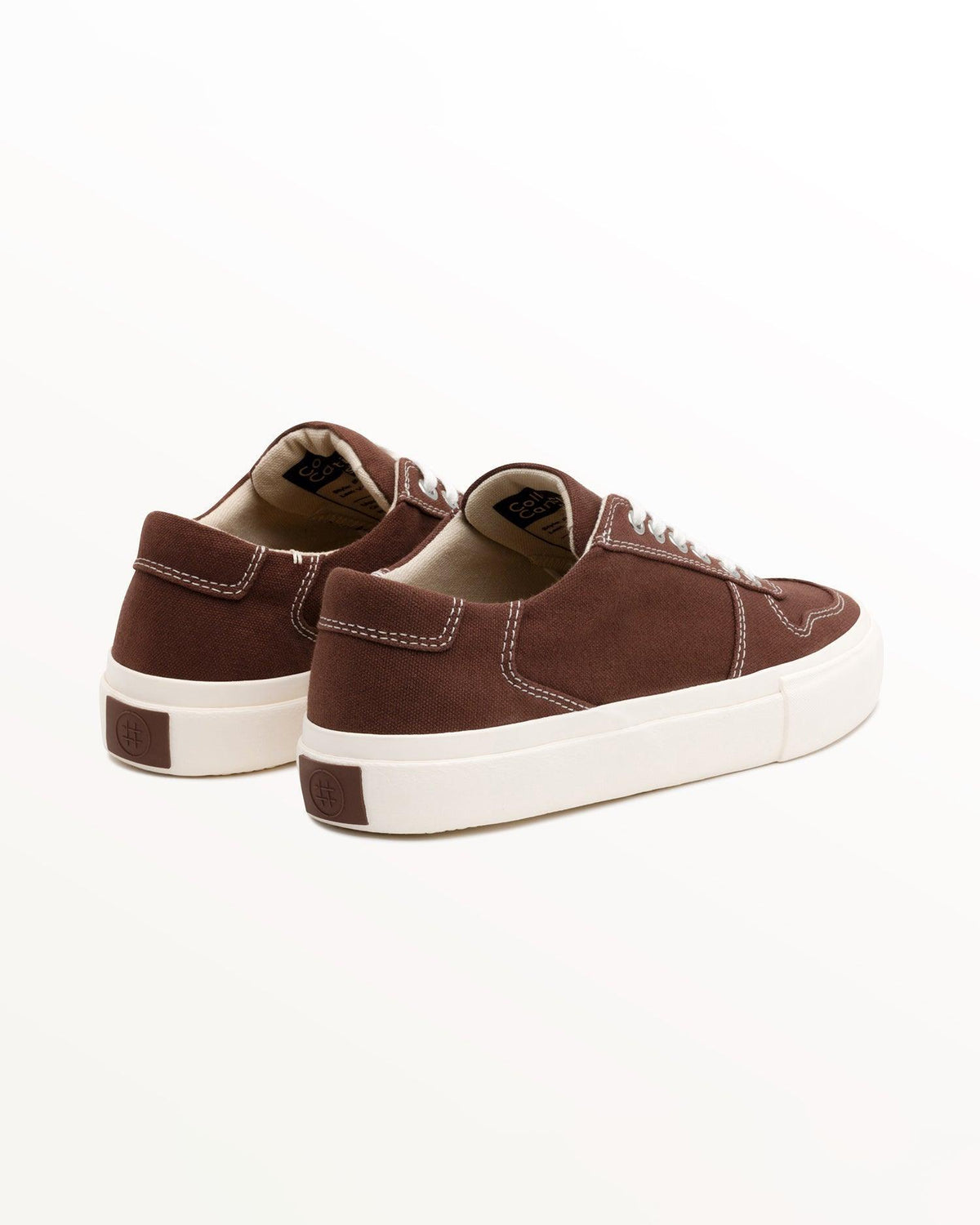 Bal Cappuccino trainers, three-quarter rear view showing brown heel patch on the off-white sole