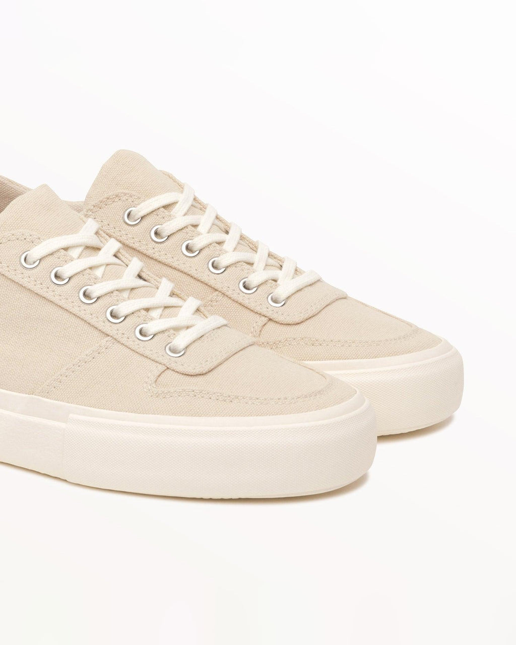 Close-up of natural organic cotton canvas upper, eyelets and laces on Bal Natural