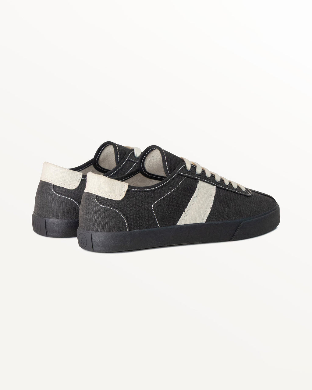 Looper Hemp Black/White Stitch trainers, three-quarter rear view showing ecru heel tabs