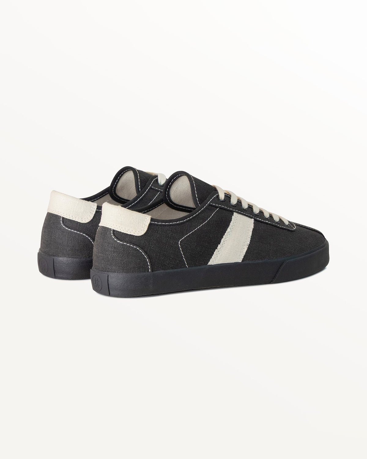 Looper Hemp Black/White Stitch trainers, three-quarter rear view showing ecru heel tabs