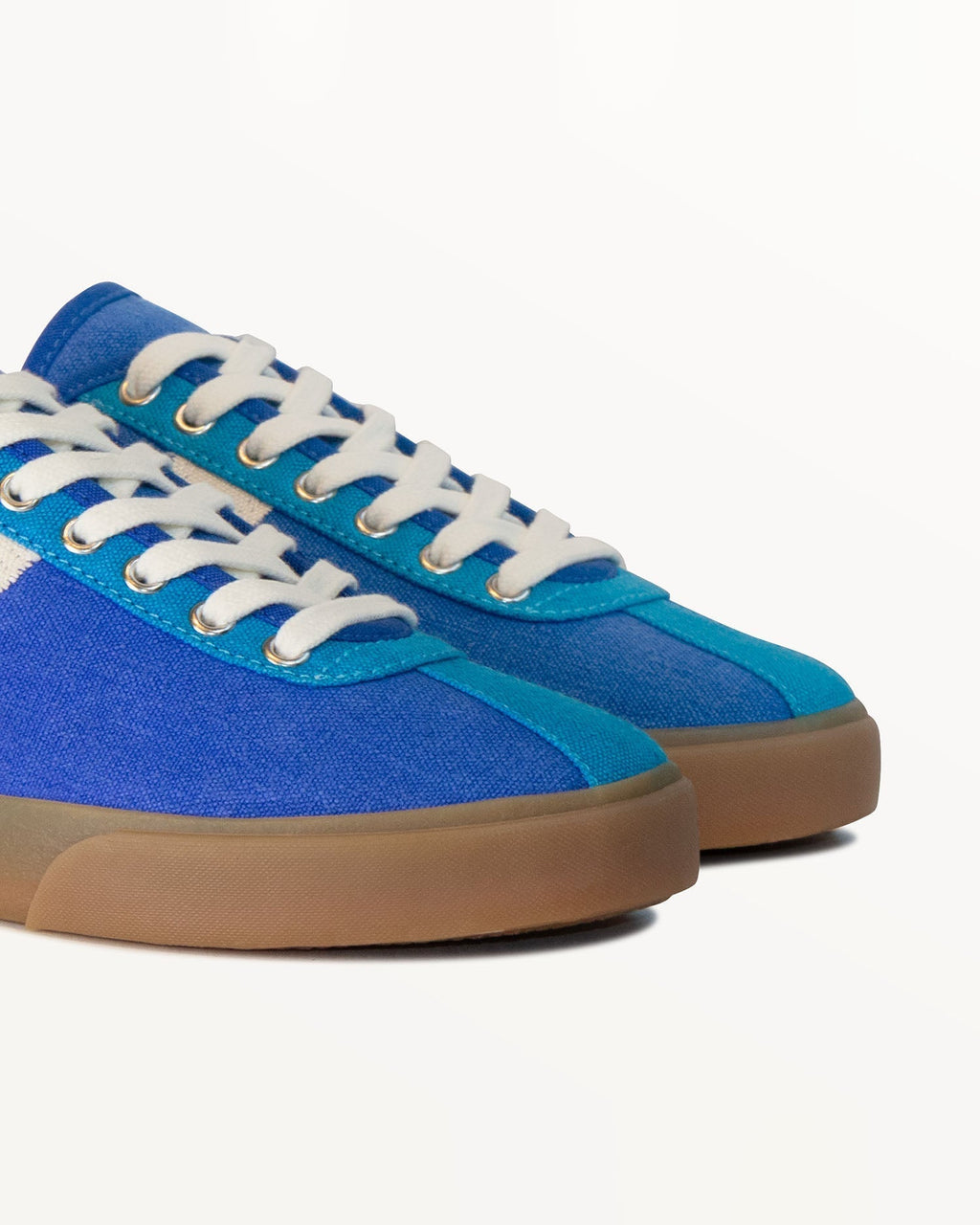 Close-up of blue hemp canvas upper, light blue eyelet panel and metal eyelets on Looper Blue