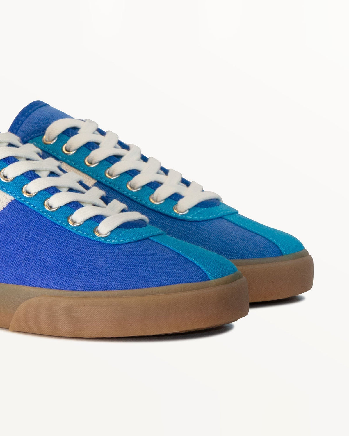Close-up of blue hemp canvas upper, light blue eyelet panel and metal eyelets on Looper Blue