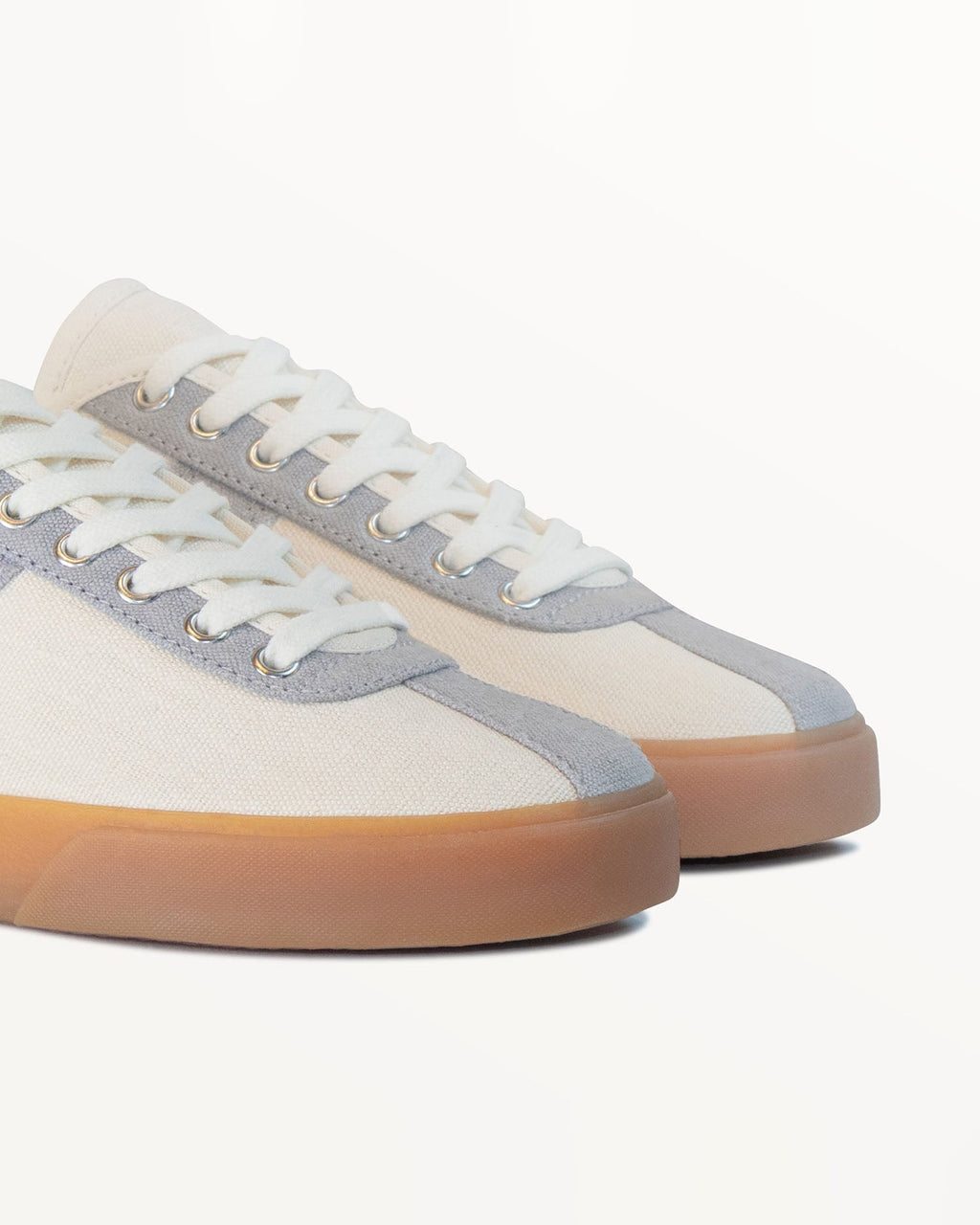 Close-up of ecru hemp canvas upper, grey eyelet panel and metal eyelets on Looper Ecru/Grey