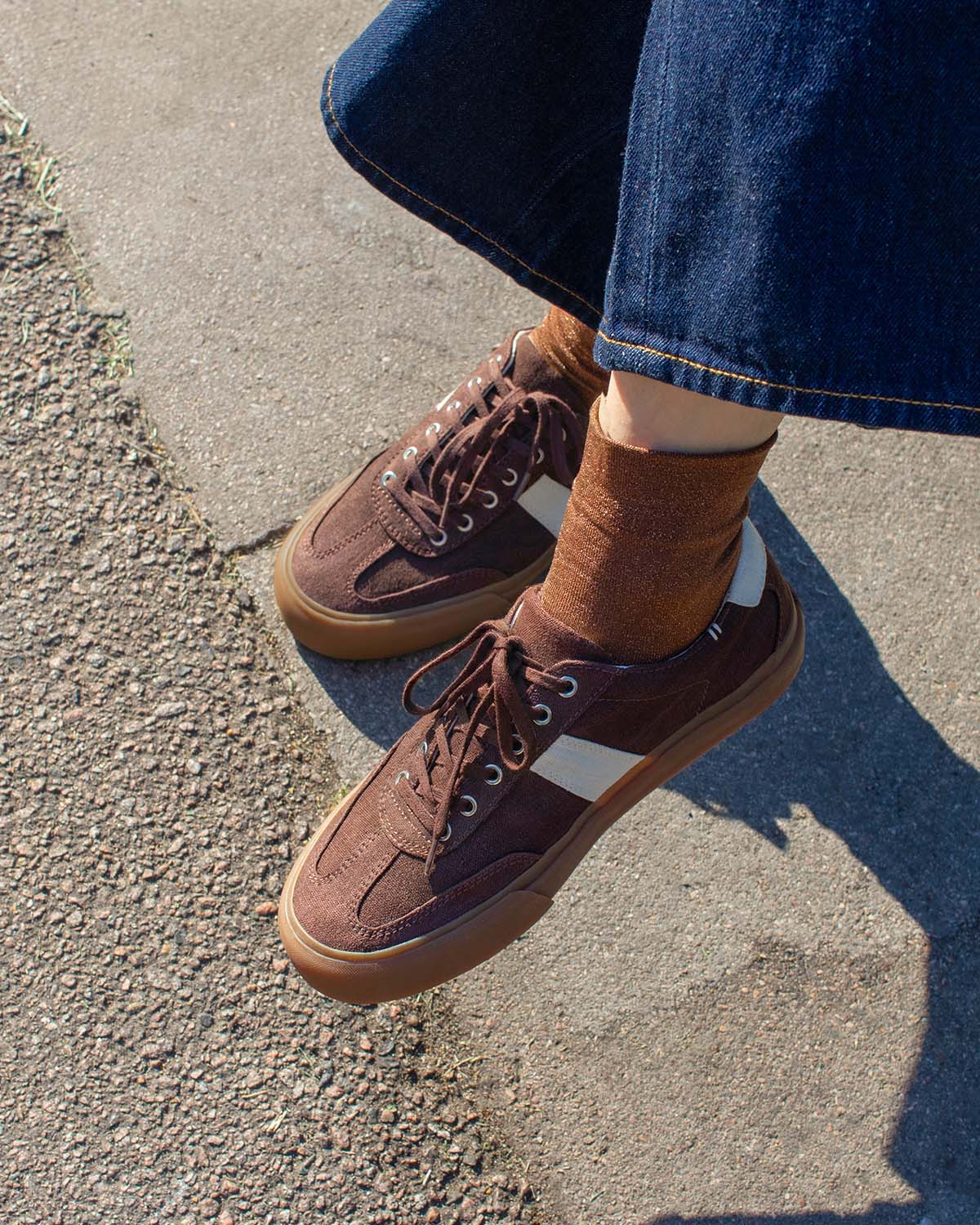 Wearing Veld Hemp Coffee/Ecru trainers with brown socks and wide-leg denim