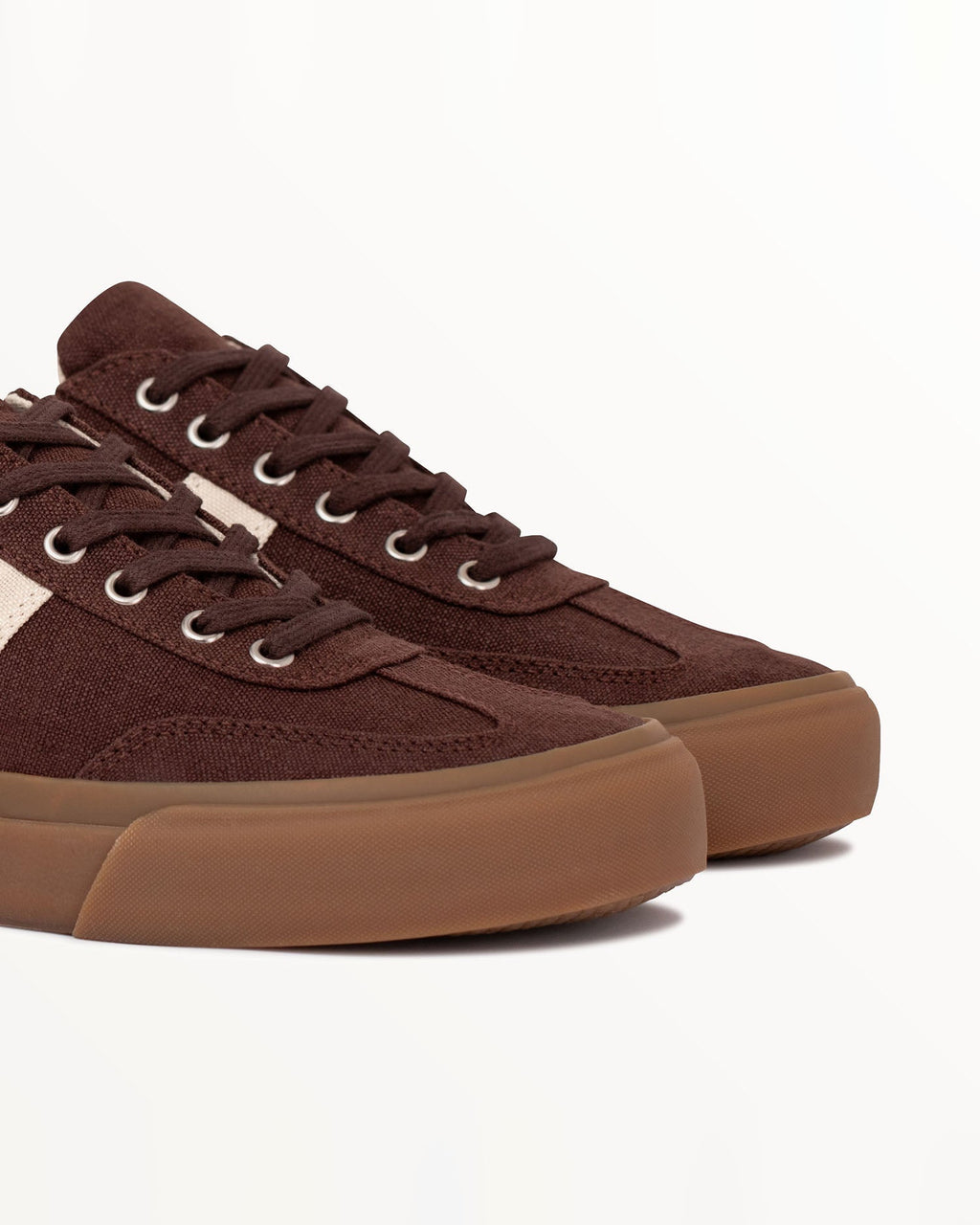 Close-up of brown hemp canvas upper and metal eyelets on Veld Coffee/Ecru