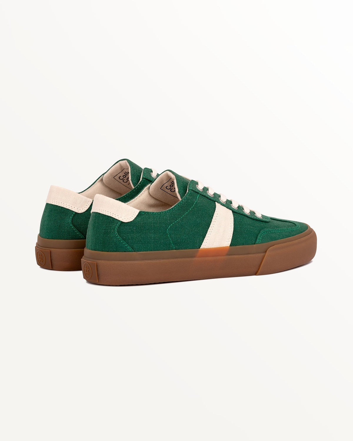 Three-quarter rear view of Veld Hemp Sage/Ecru trainers with ecru heel tabs